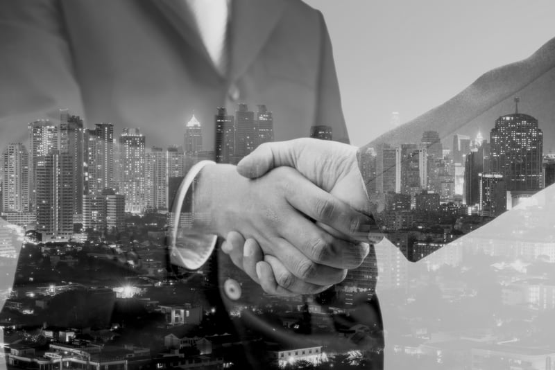 business partnership handshake in the city