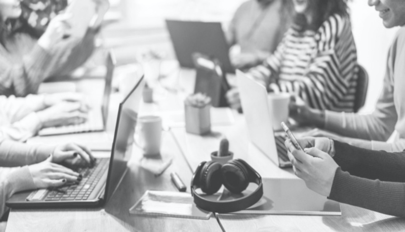 group of people engaging with content on different devices like computers and mobile devices